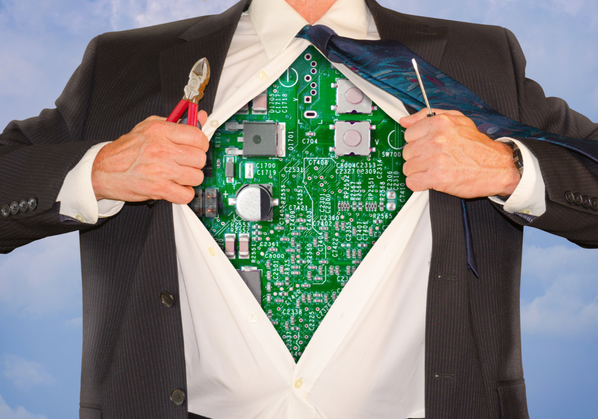 Businessman with shirt open to reveal a computer circuit board